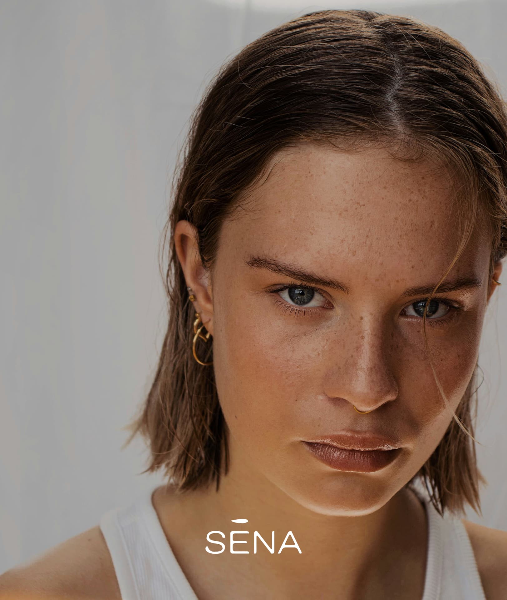 Sena brand portrait with wordmark