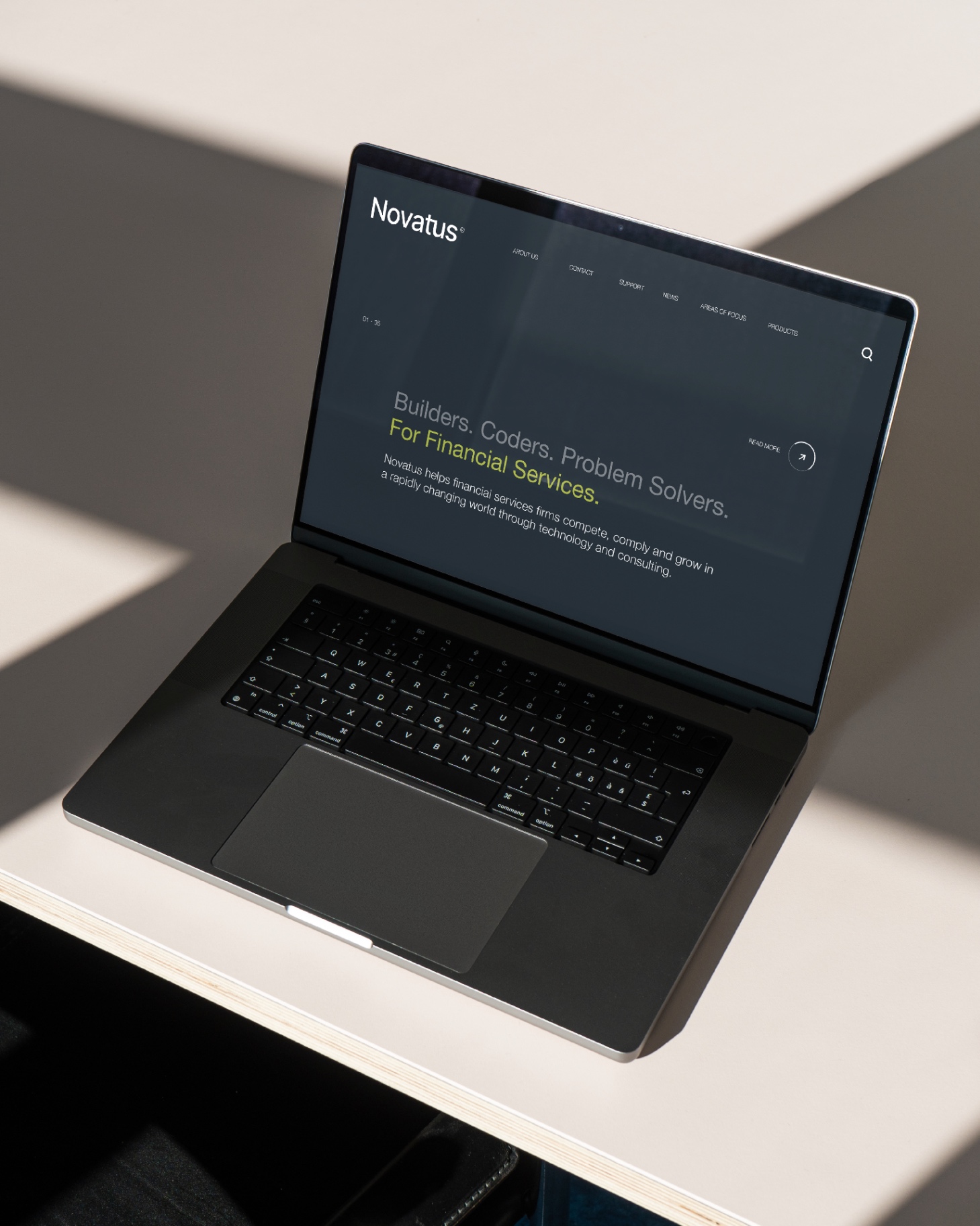 Novatus website design on laptop
